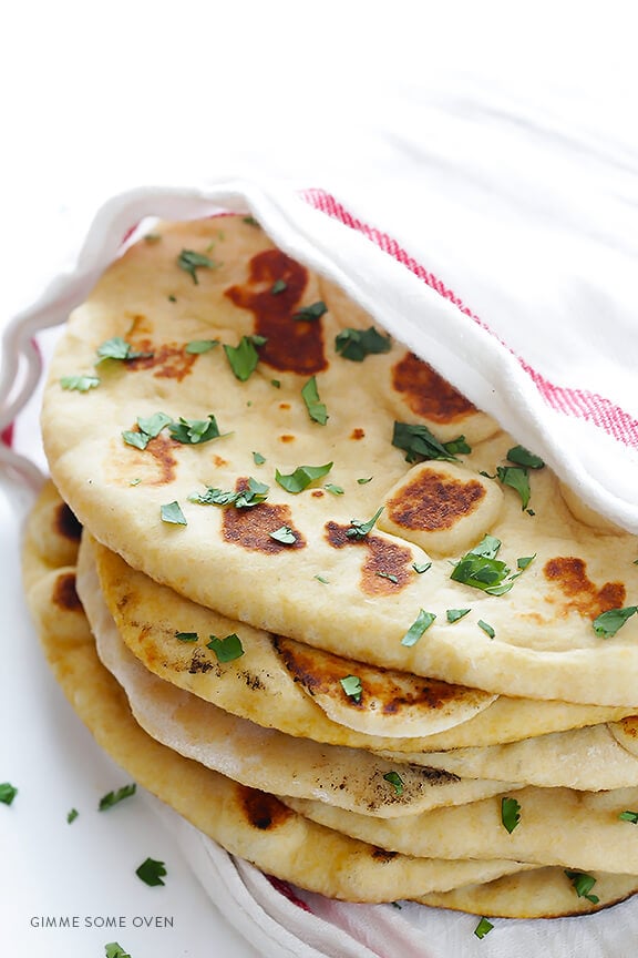 Learn how to make homemade naan (Indian flatbread) with this simple and delicious recipe! | gimmesomeoven.com