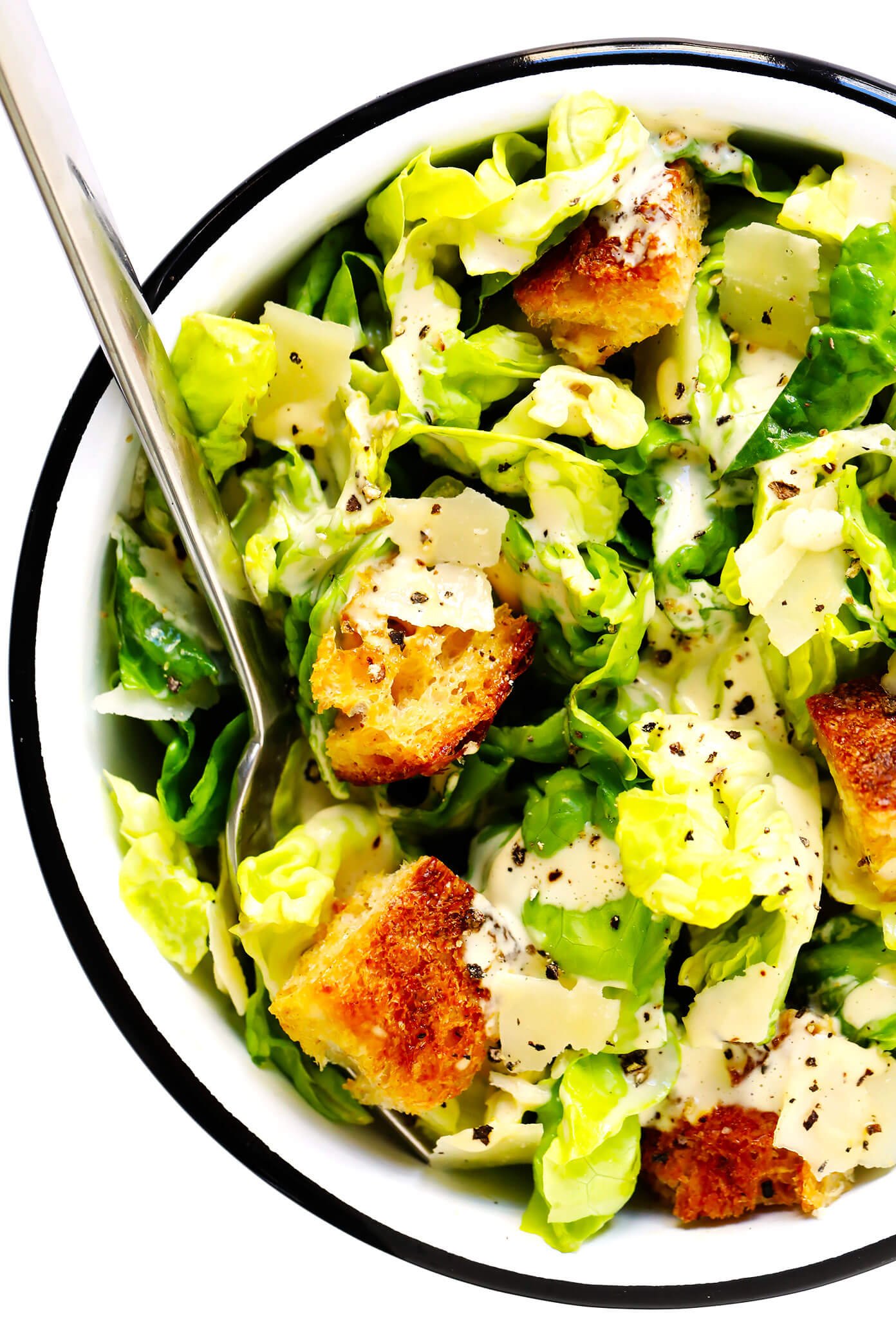 Caesar Salad In Bowl With Croutons and Parmesan