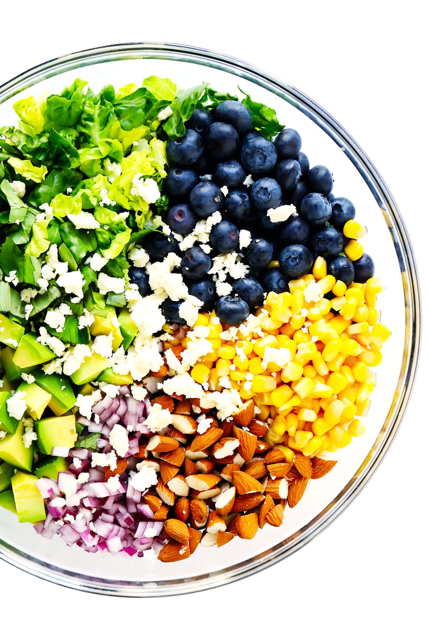 Bowl of ingredients to make blueberry corn and avocado chopped salad