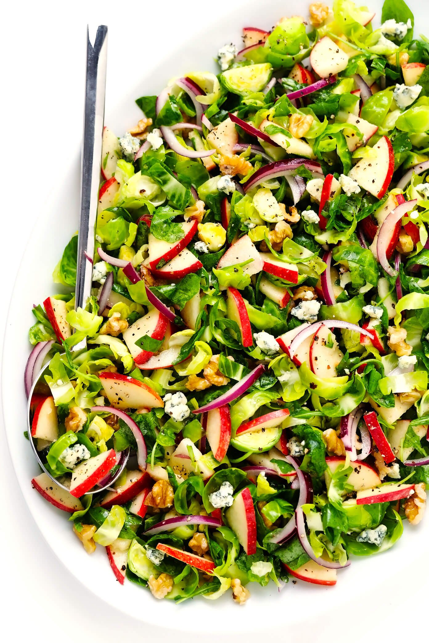 Brussels Sprouts Salad with Apples, Walnuts and Blue Cheese in Serving Bowl