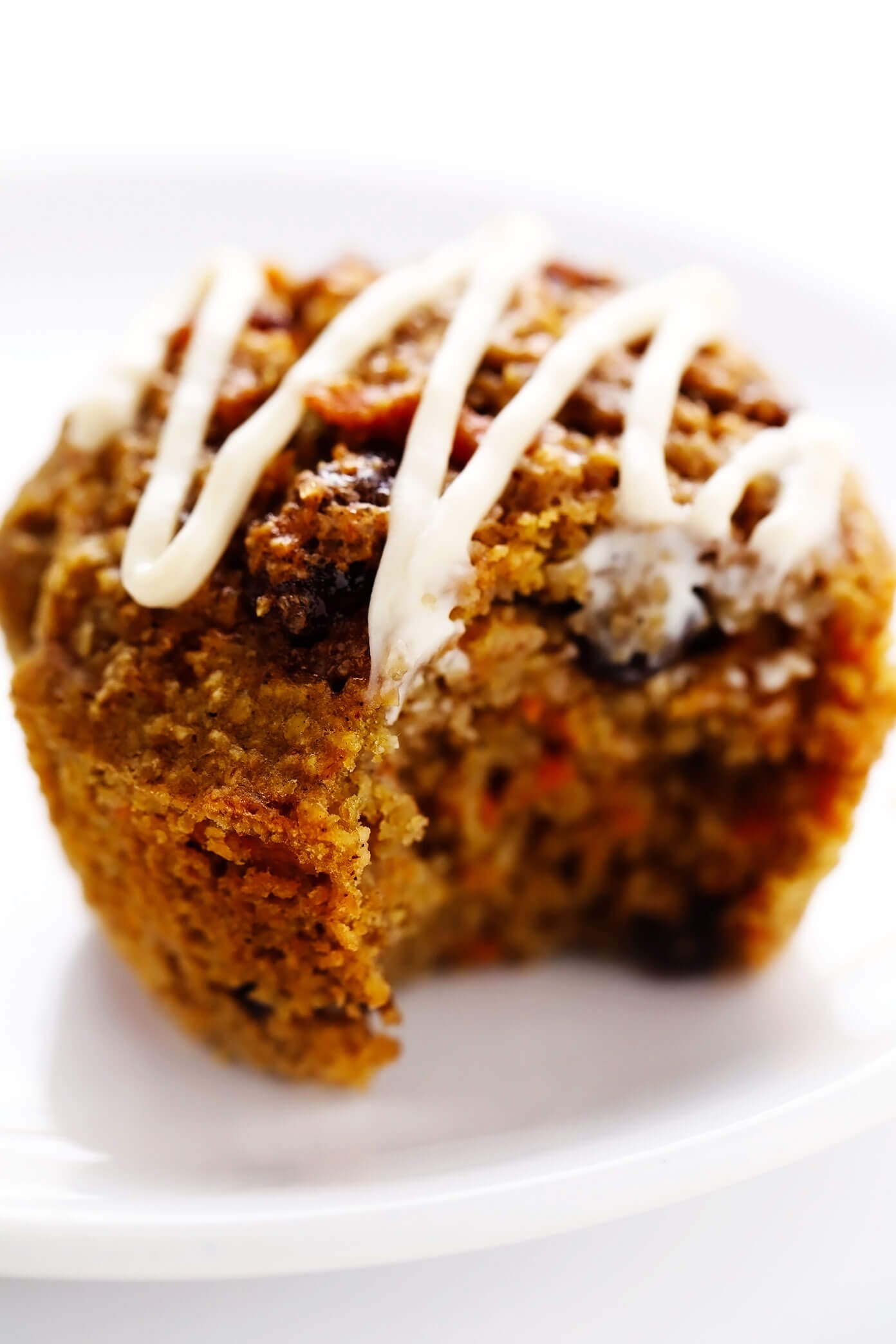 Healthy Carrot Cake Muffin with Bite Taken Out