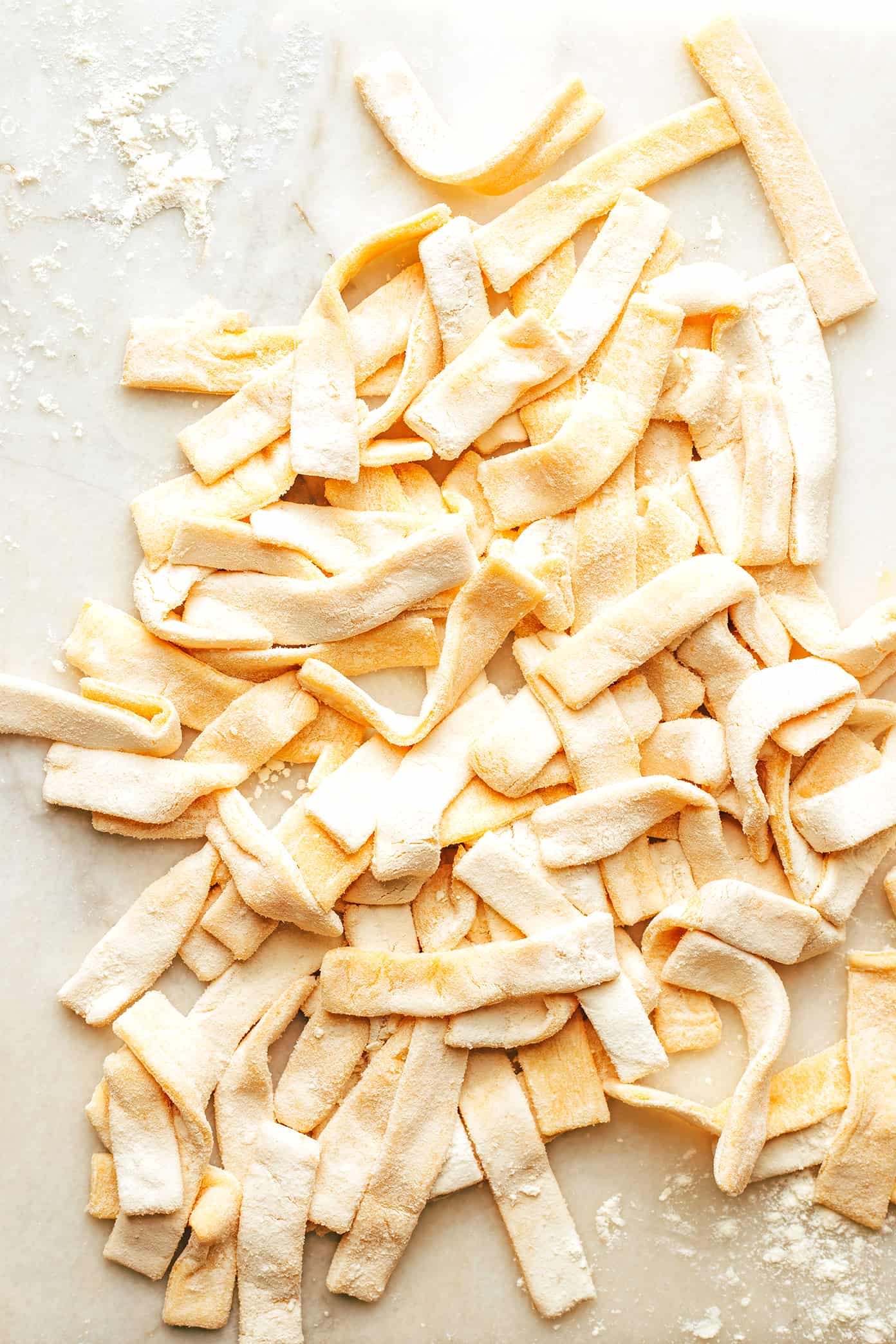 Homemade Egg Noodles on Marble Cutting Board