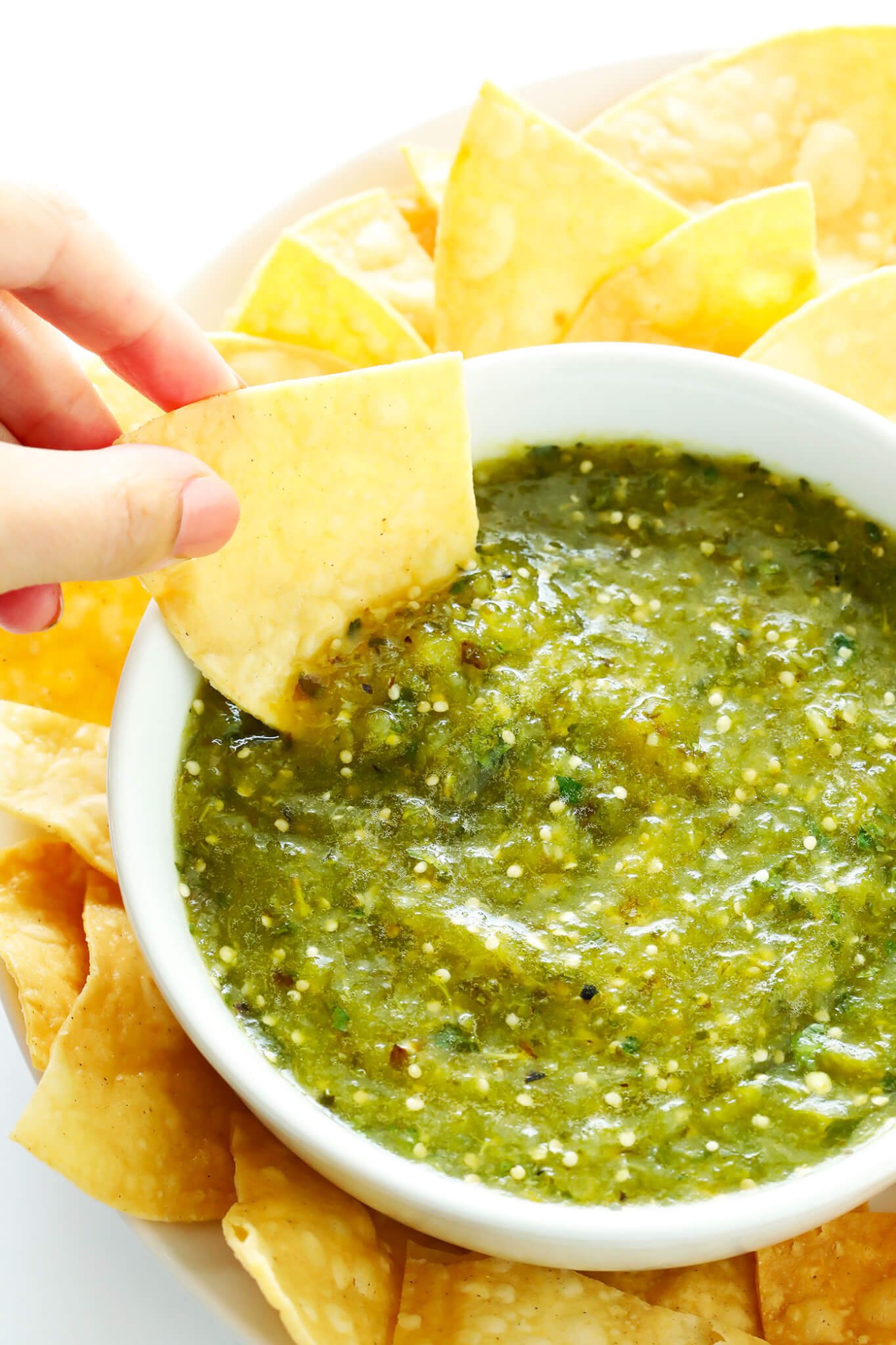 The BEST Salsa Verde recipe!! It's easy to make with roasted tomatillo, cilantro, onion, garlic, lime juice, and cumin...it only takes about 20 minutes to make...and it's the perfect appetizer with chips or accompaniment to your favorite Mexican food! | gimmesomeoven.com (Gluten-Free / Vegan / Vegetarian)