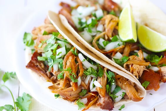 Crispy Slow Cooker Carnitas -- This favorite Mexican pork recipe is surprisingly easy to make in the crock pot, and it's perfectly tender, juicy, crispy, and SO delicious! Perfect for tacos, burritos, salads and more. | gimmesomeoven.com