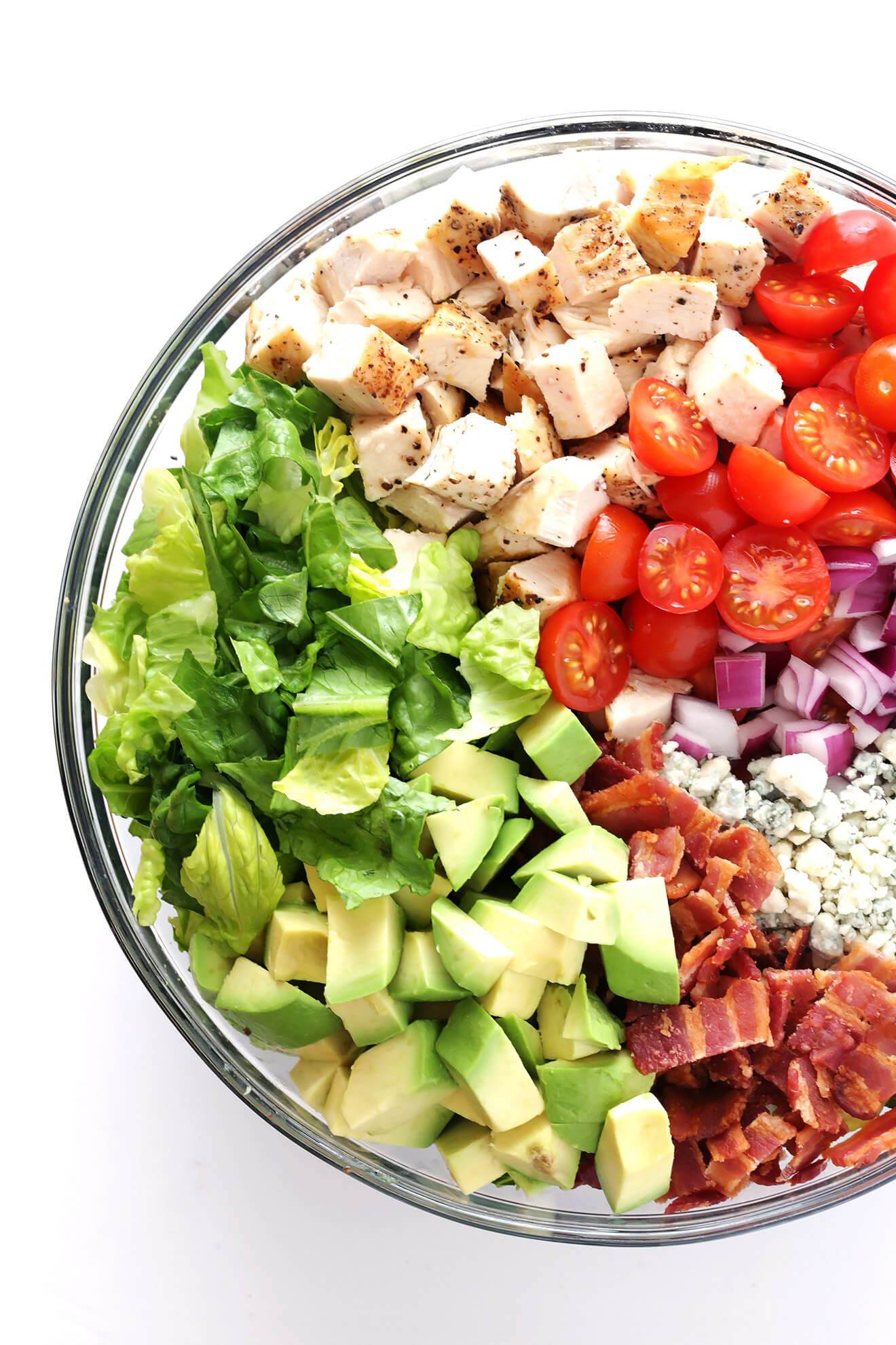 This Chicken, Bacon and Avocado Chopped Salad is made with the most delicious savory ingredients, including lots of blue cheese and a yummy red wine vinaigrette. | gimmesomeoven.com