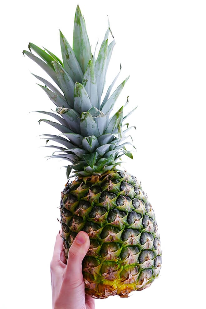 Learn how to cut a pineapple with this step-by-step video, plus tips on how to select, store, and cook with fresh pineapple! | gimmesomeoven.com