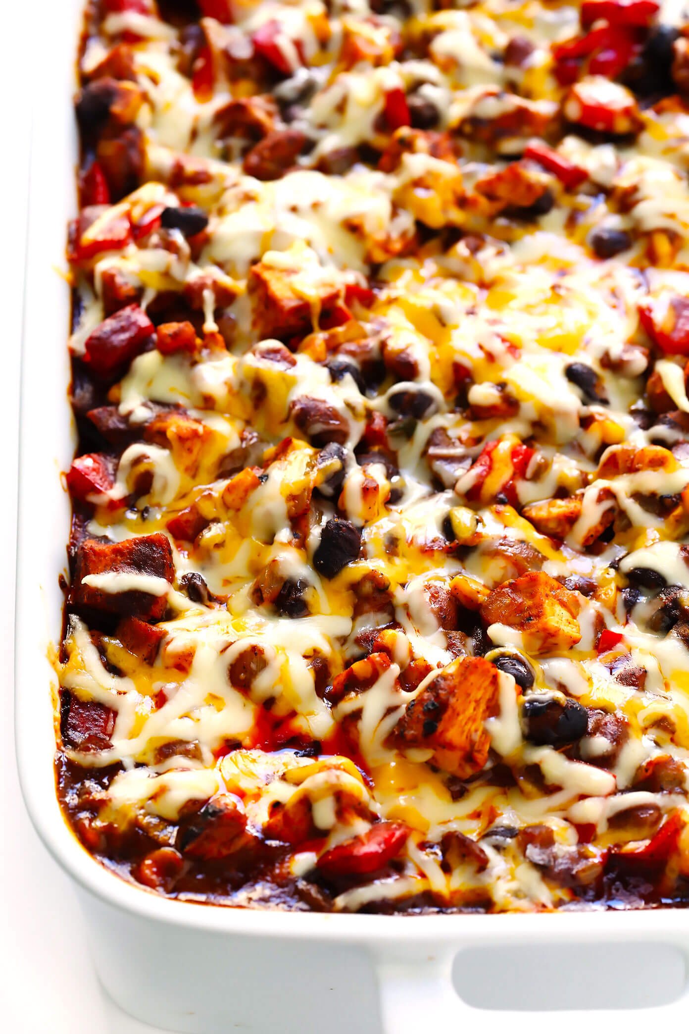 Layered Chicken Enchilada Casserole / Chicken Enchilada Casserole - Layers of sauce and tortillas mingle with a seasoned chicken and black bean mixture.