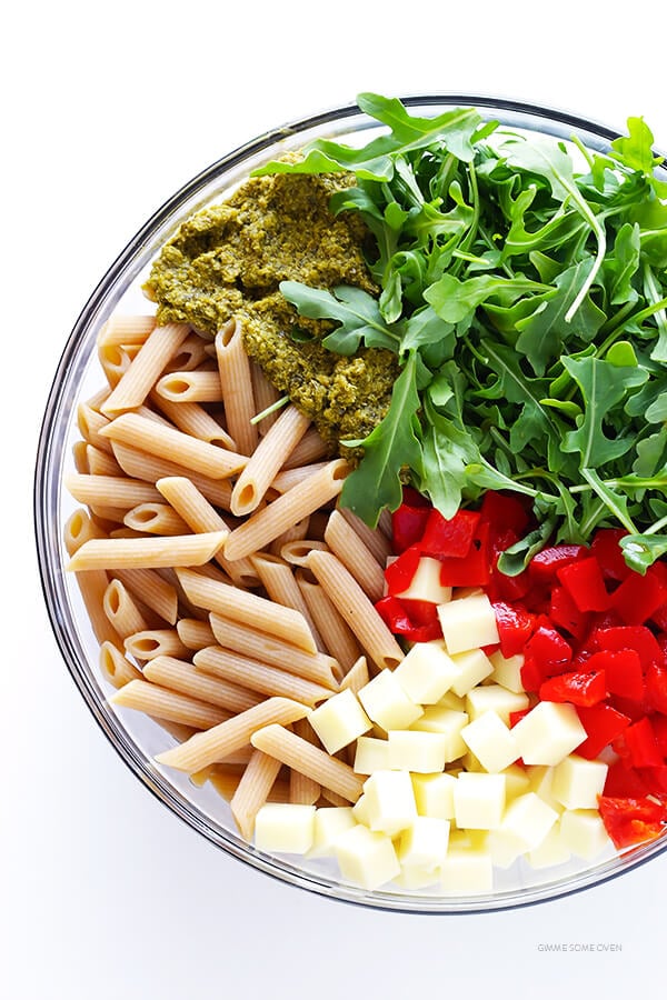 I absolutely LOVE this 5-ingredient Pasta Salad! All you need is some pasta, mozzarella, roasted red peppers, arugula, and pesto, then -- voila -- a mega-flavorful and delicious dinner will be yours to enjoy! | gimmesomeoven.com