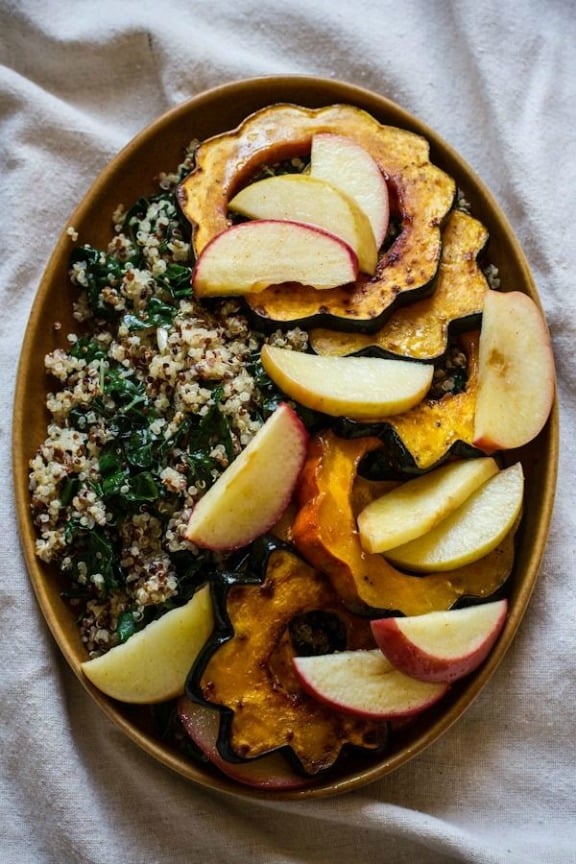 Roasted Acorn Squash and Apples with Quinoa, Kale, and Maple Tahini Dressing | edibleperspective.com