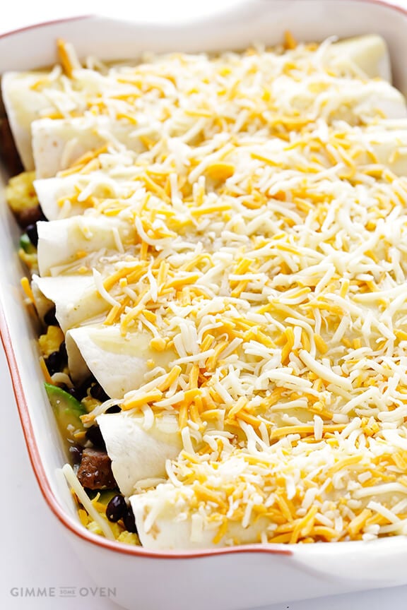 Breakfast Enchiladas -- all of your favorite breakfast ingredients rolled up into enchiladas! | gimmesomeoven.com