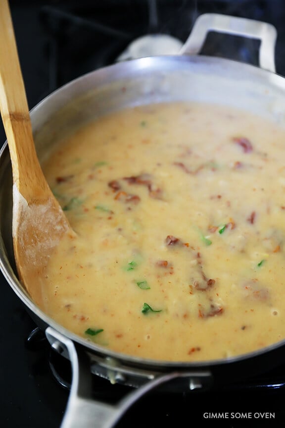 Creamy Pasta with Chicken & Sun-Dried Tomatoes -- ready to go in 30, and made with a lightened-up sauce | gimmesomeoven.com