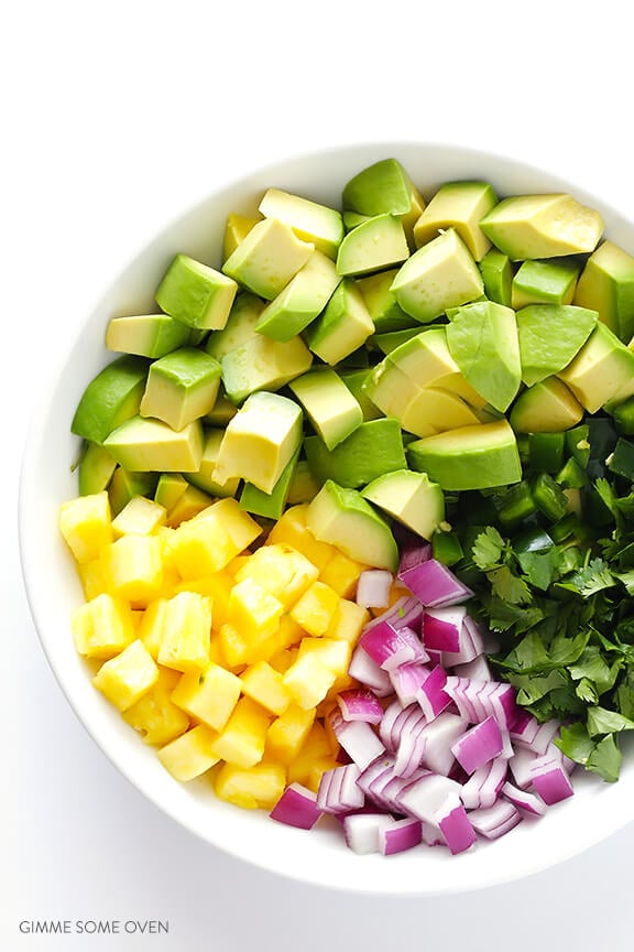 Pineapple Guacamole Recipe -- all of the goodness of this classic dip, sweetened up with some fresh pineapple! | gimmesomeoven.com