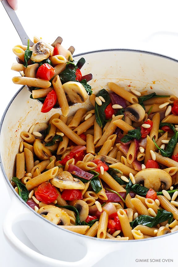 Pasta with Mushrooms Tomatoes and Spinach -- easy to make, and tossed with a delicious white wine garlic sauce | gimmesomeoven.com