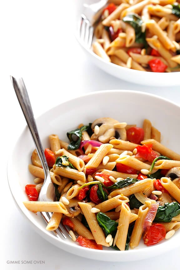 Pasta with Mushrooms Tomatoes and Spinach -- easy to make, and tossed with a delicious white wine garlic sauce | gimmesomeoven.com