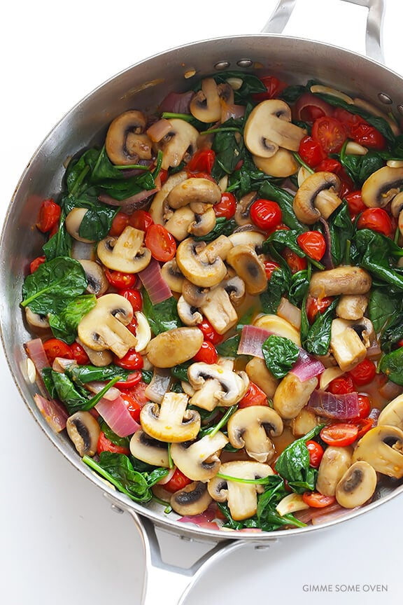 Pasta with Mushrooms Tomatoes and Spinach -- easy to make, and tossed with a delicious white wine garlic sauce | gimmesomeoven.com