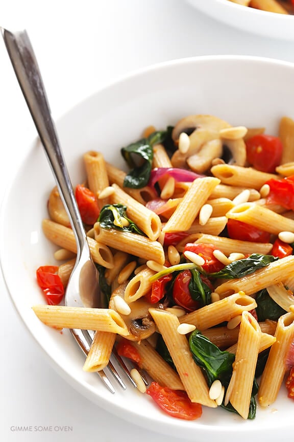 Pasta with Mushrooms Tomatoes and Spinach -- easy to make, and tossed with a delicious white wine garlic sauce | gimmesomeoven.com