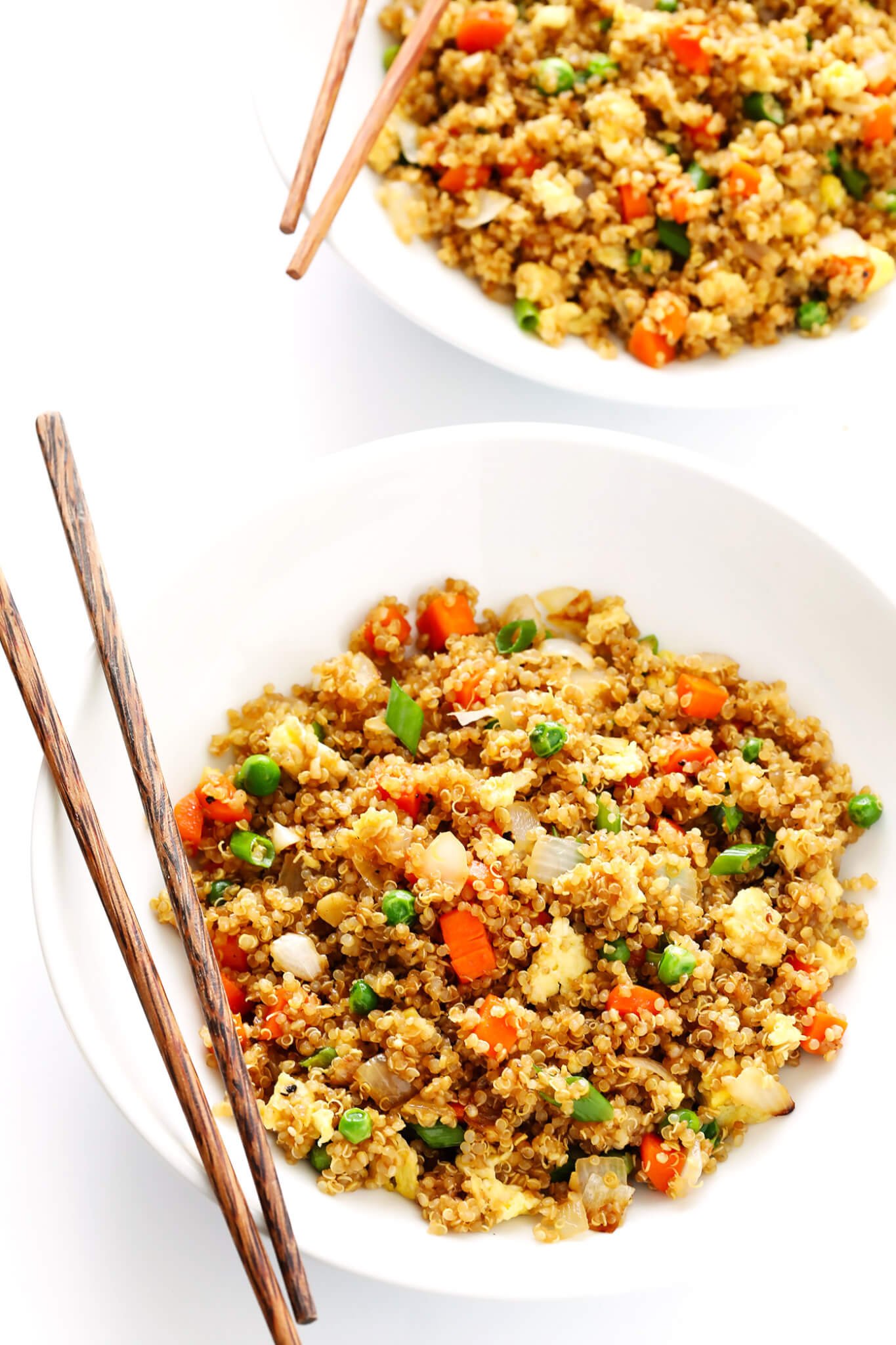 This 15-Minute Quinoa Fried "Rice" recipe is the best!! It's super easy to make, full of big flavors, and it's the perfect side or main dish. Feel free to add chicken, pork, tofu, shrimp, beef, or veggies if you'd like! | gimmesomeoven.com (Vegetarian)