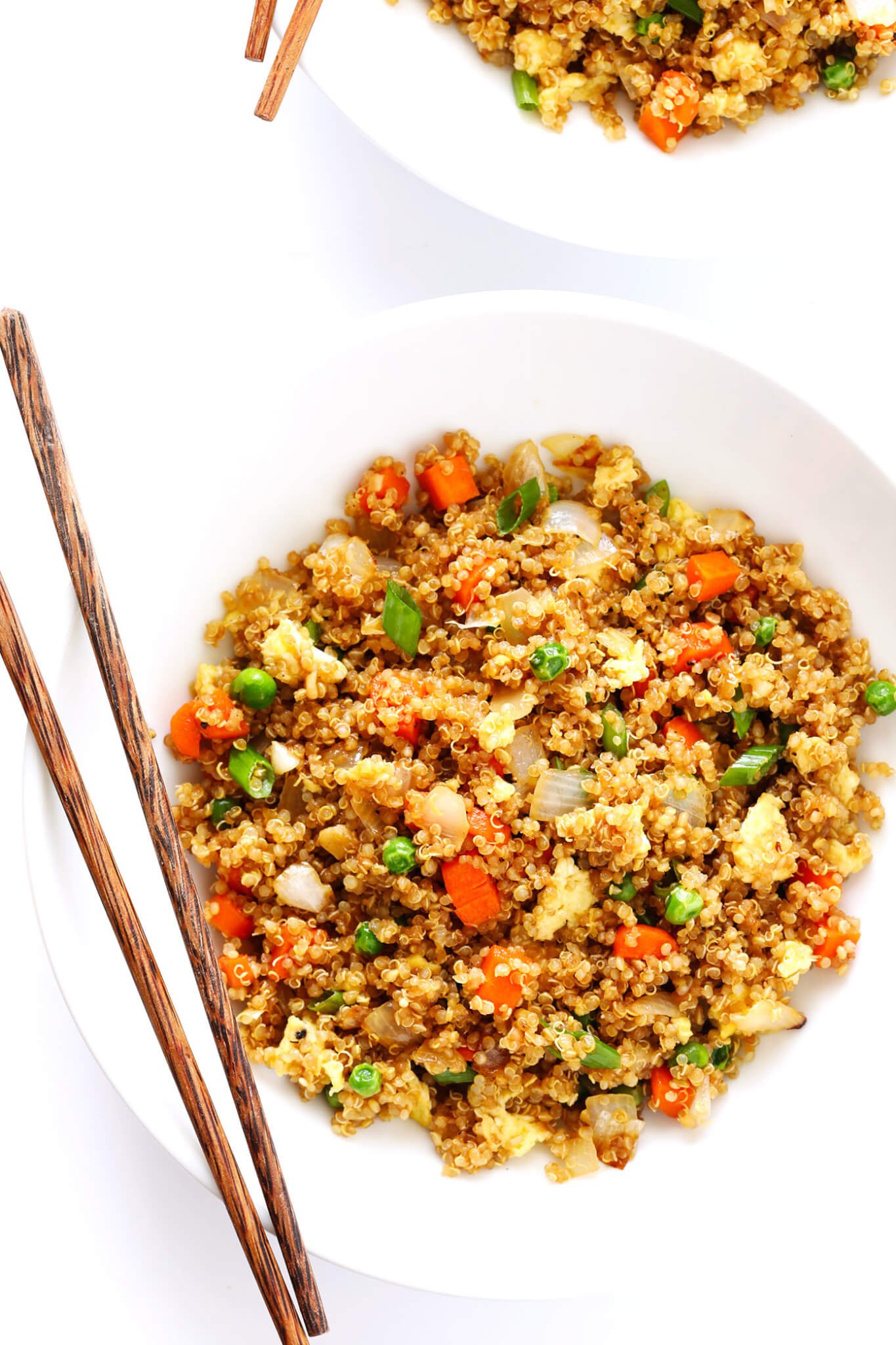 This 15-Minute Quinoa Fried "Rice" recipe is the best!! It's super easy to make, full of big flavors, and it's the perfect side or main dish. Feel free to add chicken, pork, tofu, shrimp, beef, or veggies if you'd like! | gimmesomeoven.com (Vegetarian)