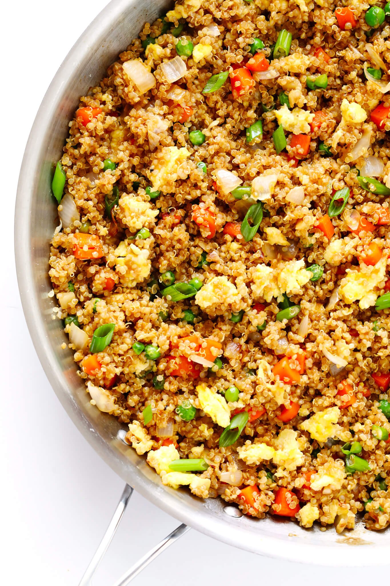 This 15-Minute Quinoa Fried "Rice" recipe is the best!! It's super easy to make, full of big flavors, and it's the perfect side or main dish. Feel free to add chicken, pork, tofu, shrimp, beef, or veggies if you'd like! | gimmesomeoven.com (Vegetarian)