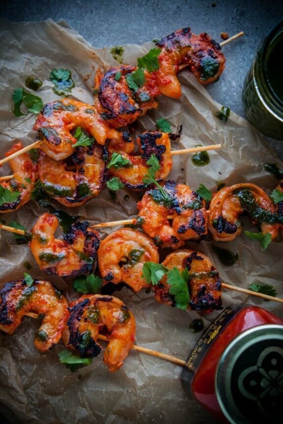 Grilled Harissa Shrimp Skewers with Basil Oil and Cilantro | bloggingoverthyme.com