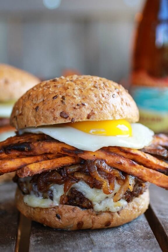 Epic Crispy Quinoa Burgers Topped with Sweet Potato Fries, Beer Caramelized Onions & Gruyere | halfbakedharvest.com