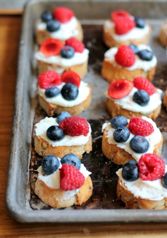 Summer Berry Crostini with Lemon Ricotta & Honey | ambitiouskitchen.com