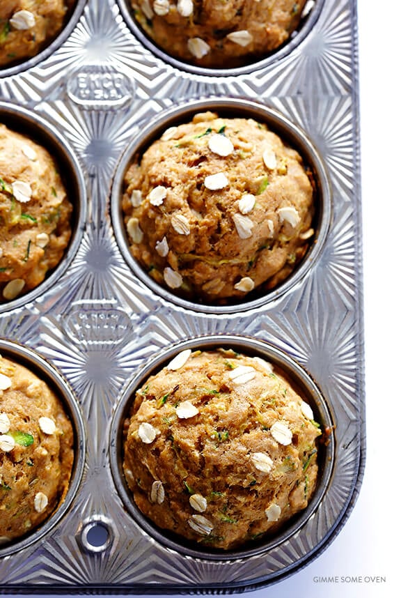 Love this Healthier Zucchini Muffins recipe! It's easy to make, made with healthier ingredients (including oatmeal), and so flavorful and delicious! My kind of summer breakfast comfort food. :) | gimmesomeoven.com