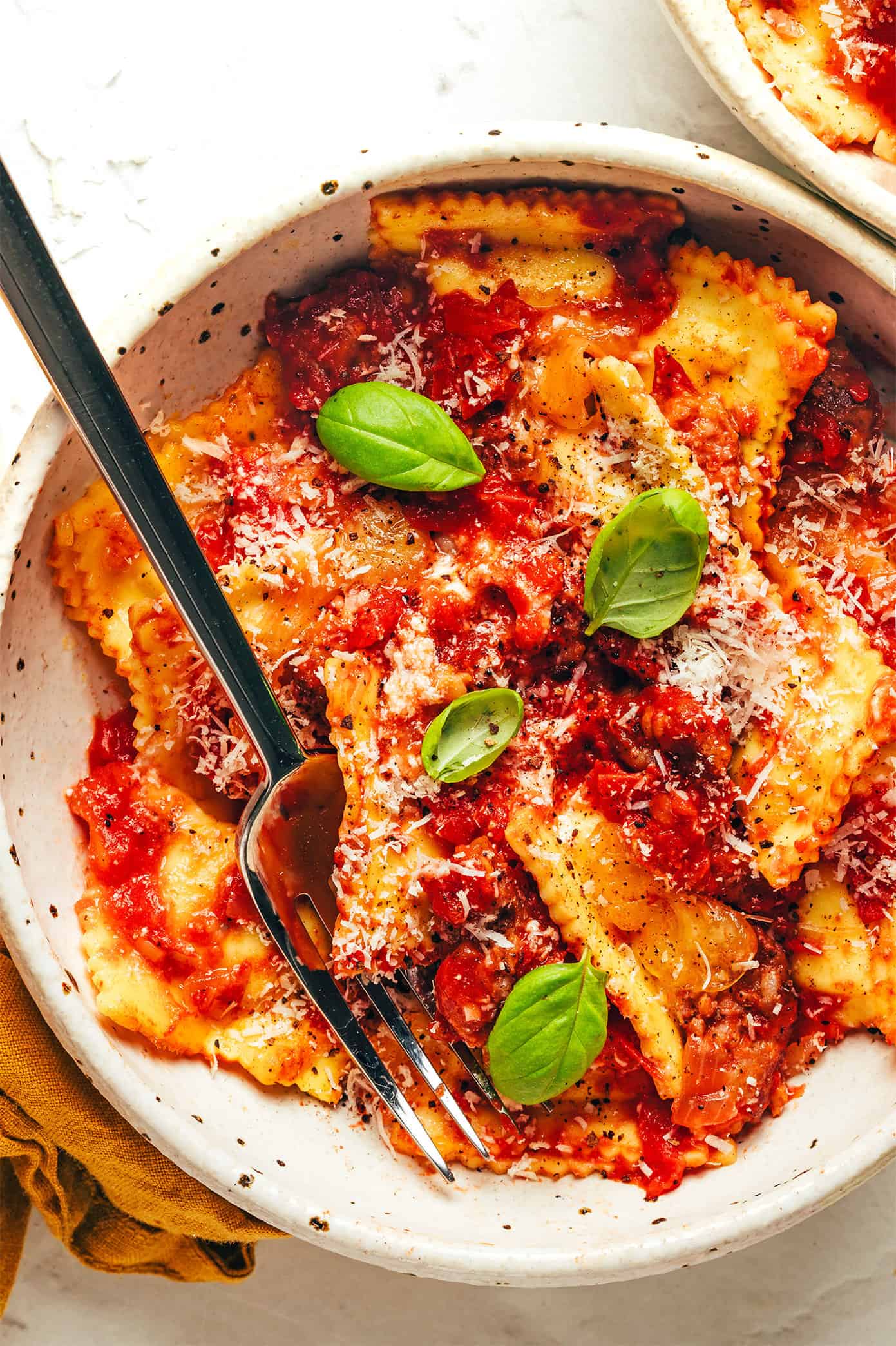 Ravioli lasagna in bowl with fork