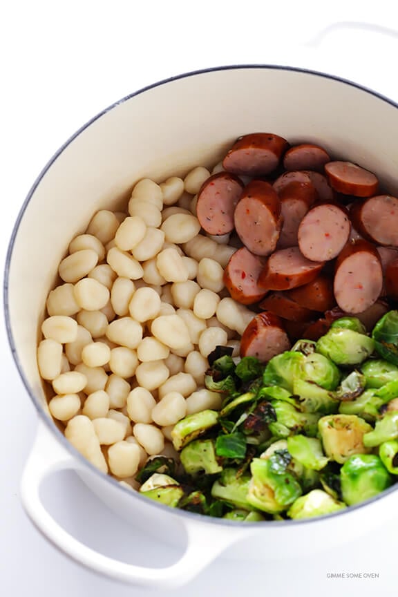 Gnocchi with Brussels Sprouts, Chicken Sausage and Kale Pesto -- quick and easy to make and SO flavorful! | gimmesomeoven.com