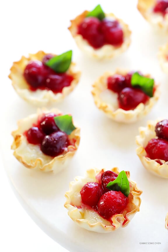 Super-Easy Cranberry Baked Brie Bites Recipe -- the perfect appetizer for holiday parties or anytime you're craving savory and sweet! | gimmesomeoven.com