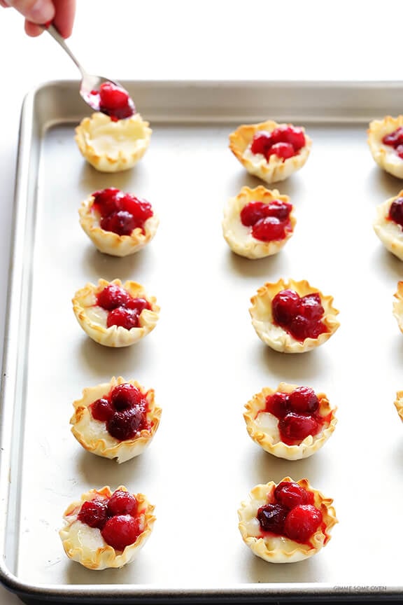 Super-Easy Cranberry Baked Brie Bites Recipe -- the perfect appetizer for holiday parties or anytime you're craving savory and sweet! | gimmesomeoven.com