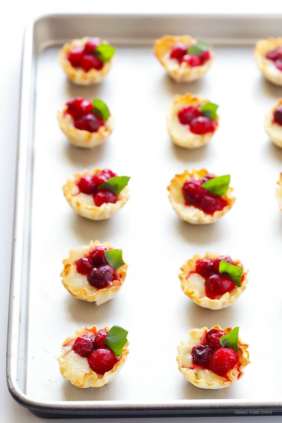 Super-Easy Cranberry Baked Brie Bites Recipe -- the perfect appetizer for holiday parties or anytime you're craving savory and sweet! | gimmesomeoven.com