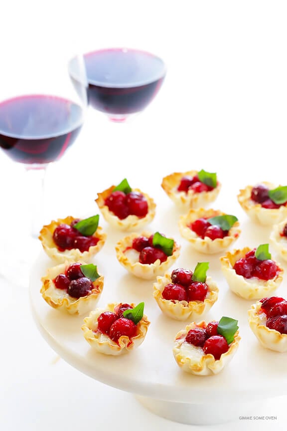 Super-Easy Cranberry Baked Brie Bites Recipe -- the perfect appetizer for holiday parties or anytime you're craving savory and sweet! | gimmesomeoven.com