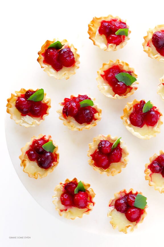 Super-Easy Cranberry Baked Brie Bites Recipe -- the perfect appetizer for holiday parties or anytime you're craving savory and sweet! | gimmesomeoven.com