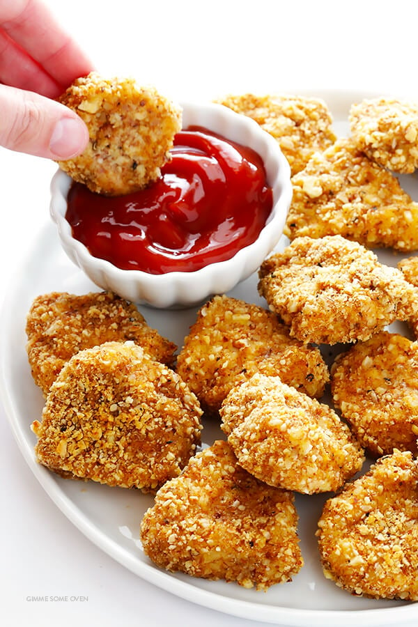 Almond-Crusted Chicken Nuggets -- easy to make, baked instead of fried, and irresistibly delicious! | gimmesomeoven.com