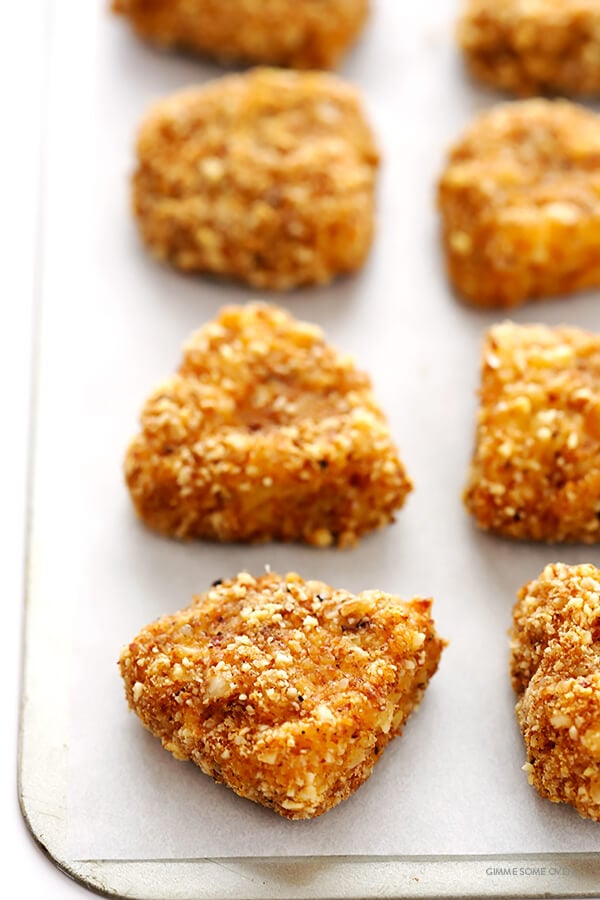 Almond-Crusted Chicken Nuggets -- easy to make, baked instead of fried, and irresistibly delicious! | gimmesomeoven.com