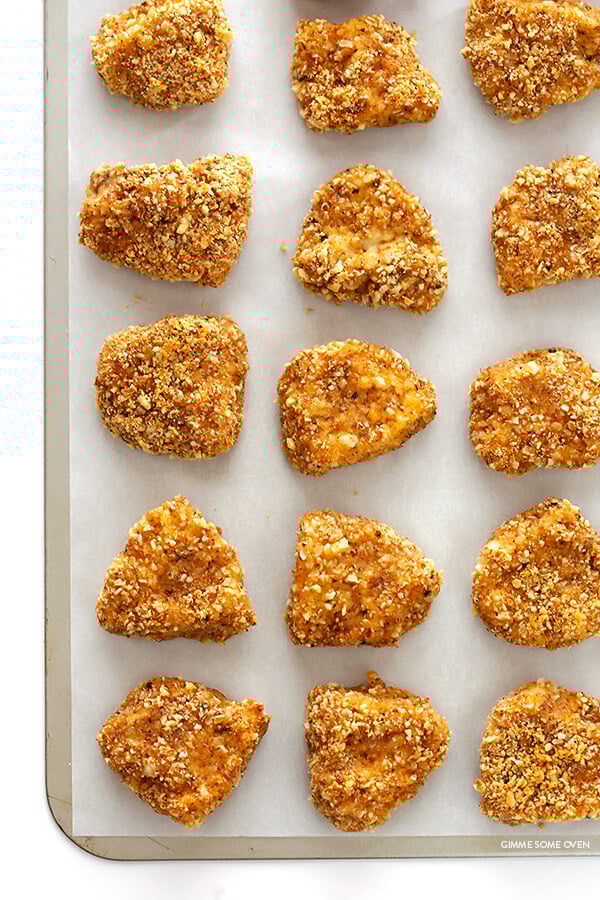 Almond-Crusted Chicken Nuggets -- easy to make, baked instead of fried, and irresistibly delicious! | gimmesomeoven.com