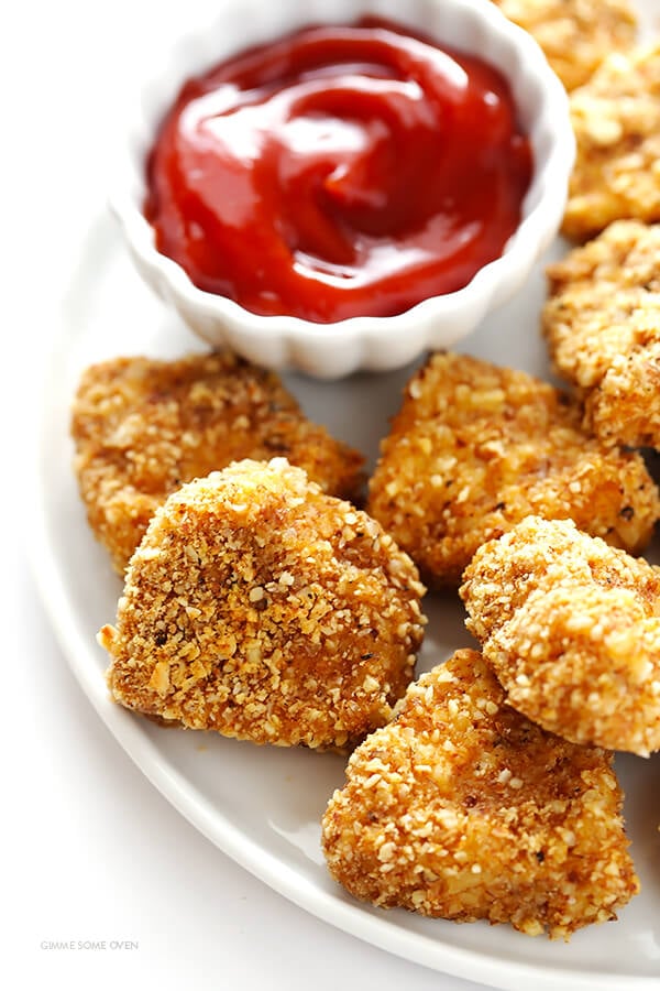 Almond-Crusted Chicken Nuggets -- easy to make, baked instead of fried, and irresistibly delicious! | gimmesomeoven.com