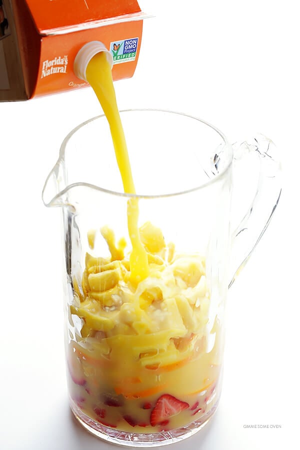 Mimosa Sangria -- quick and easy to make, and kicked up a notch with lots of delicious fresh fruit! | gimmesomeoven.com