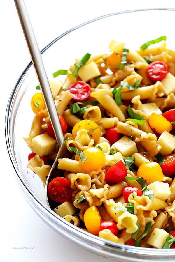 This Caprese Pasta Salad Recipe is quick and easy to make, tossed with a delicious balsamic vinaigrette, and perfect for picnics, potlucks, or just a regular weeknight meal! | gimmesomeoven.com