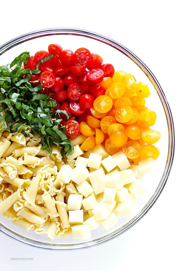 This Caprese Pasta Salad Recipe is quick and easy to make, tossed with a delicious balsamic vinaigrette, and perfect for picnics, potlucks, or just a regular weeknight meal! | gimmesomeoven.com