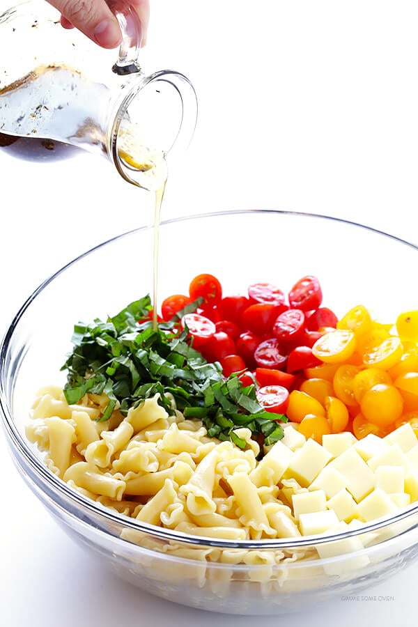 This Caprese Pasta Salad Recipe is quick and easy to make, tossed with a delicious balsamic vinaigrette, and perfect for picnics, potlucks, or just a regular weeknight meal! | gimmesomeoven.com