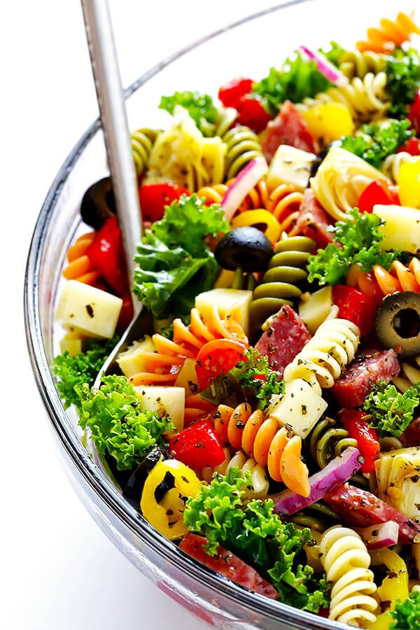 This Rainbow Antipasto Pasta Salad is the perfect way to use up leftover antipasto ingredients! Plus, it's easy to make, tossed with a zesty Italian herb vinaigrette, and absolutely delicious! | gimmesomeoven.com