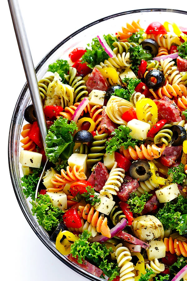 This Rainbow Antipasto Pasta Salad is the perfect way to use up leftover antipasto ingredients! Plus, it's easy to make, tossed with a zesty Italian herb vinaigrette, and absolutely delicious! | gimmesomeoven.com