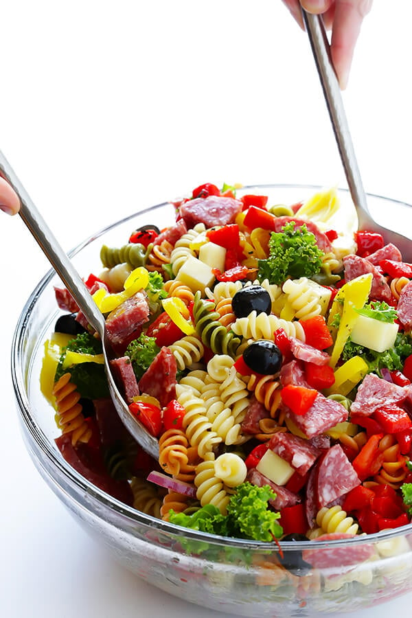 This Rainbow Antipasto Pasta Salad is the perfect way to use up leftover antipasto ingredients! Plus, it's easy to make, tossed with a zesty Italian herb vinaigrette, and absolutely delicious! | gimmesomeoven.com