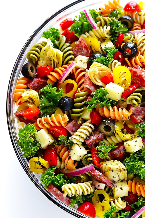 This Rainbow Antipasto Pasta Salad is the perfect way to use up leftover antipasto ingredients! Plus, it's easy to make, tossed with a zesty Italian herb vinaigrette, and absolutely delicious! | gimmesomeoven.com