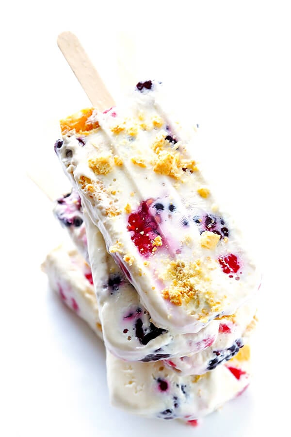 These Berry Cheesecake Popsicles are quick and easy to prep, they're chocked full of fresh berries and graham crackers, and they really do taste like cheesecake! | gimmesomeoven.com