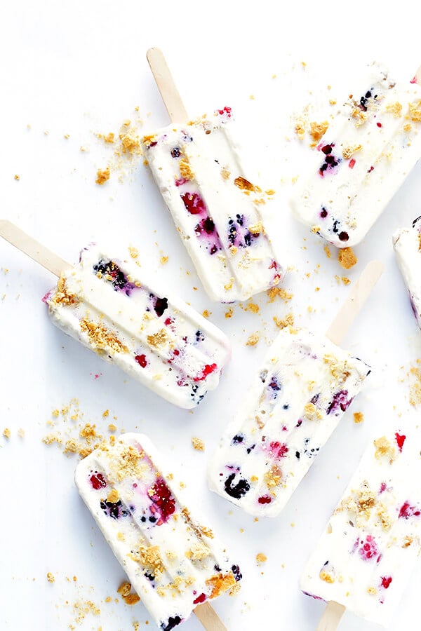 These Berry Cheesecake Popsicles are quick and easy to prep, they're chocked full of fresh berries and graham crackers, and they really do taste like cheesecake! | gimmesomeoven.com