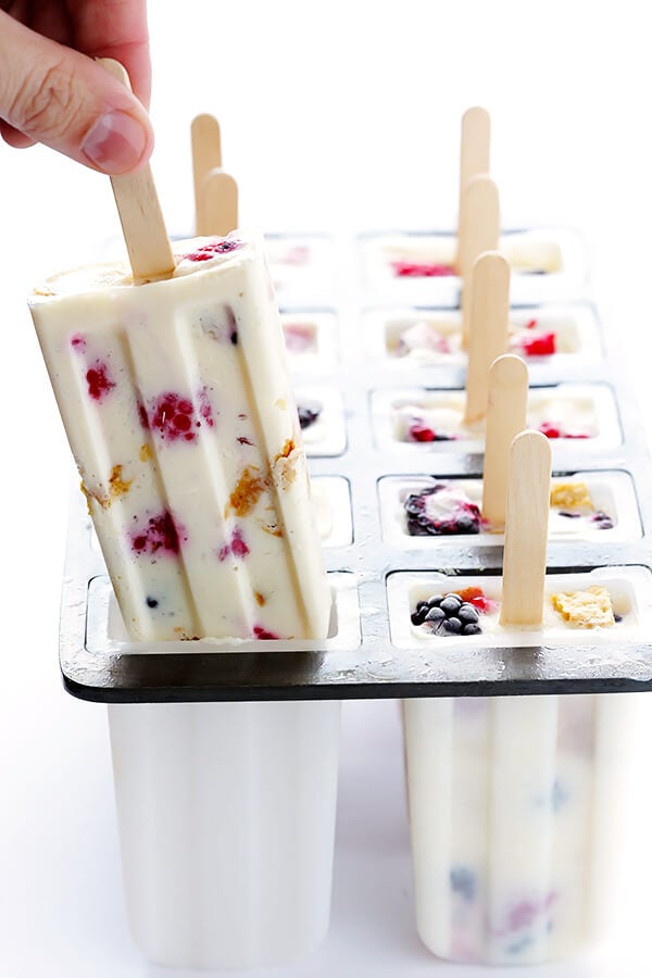 These Berry Cheesecake Popsicles are quick and easy to prep, they're chocked full of fresh berries and graham crackers, and they really do taste like cheesecake! | gimmesomeoven.com