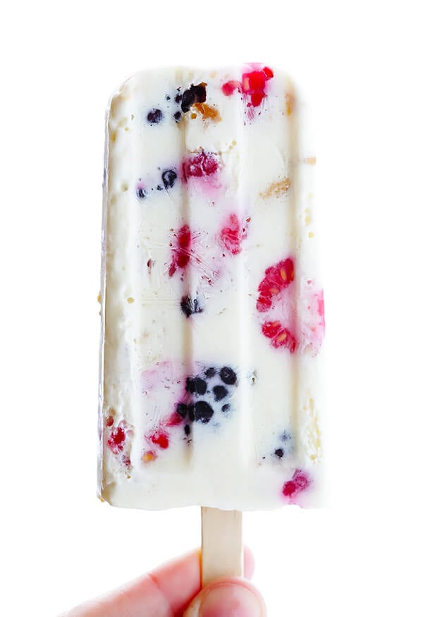 These Berry Cheesecake Popsicles are quick and easy to prep, they're chocked full of fresh berries and graham crackers, and they really do taste like cheesecake! | gimmesomeoven.com